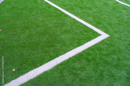 green artificial grass turf with white line for sports field background texture