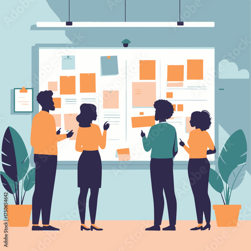 Team members collaborating on a project using a whiteboard.