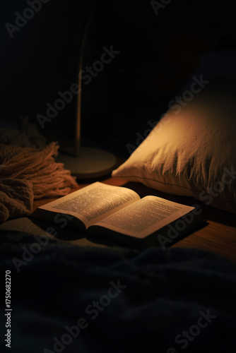 Wallpaper Mural Low-light image of bedside table with half-open book under dim warm lamp, shallow depth of field, soft texture of fabric and wood, cinematic lighting balance, concept of reading before Torontodigital.ca