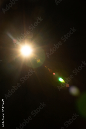 Sun flare on the black background