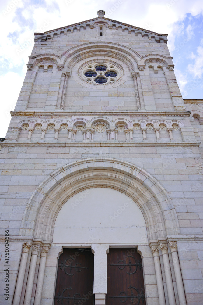 Fototapeta premium Front view of old church building with arched entrance