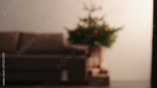 Blurred background on chrismas tree with gift boxes in living room