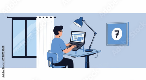 Young man working remotely on a laptop at his desk.