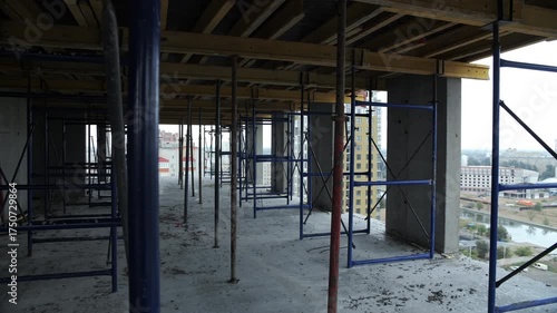 Scaffolding inside unfinished high-rise building floor