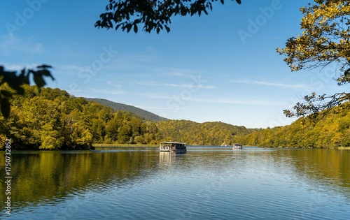 The electric boat for tourists on the Lake Kozjak, one of the Plitvice Lakes, on a sunny, autumn day. 