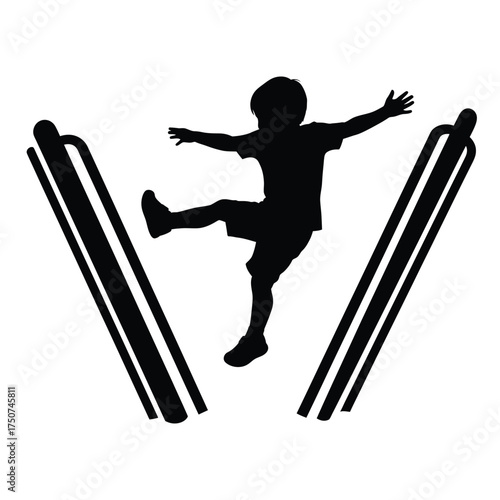 Silhouette of a child balancing between two parallel bars with arms outstretched for balance