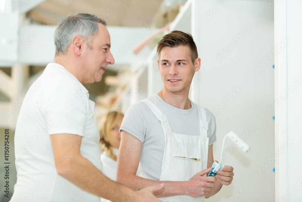 Fototapeta premium portrait of workman with colleague