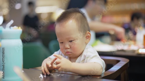 Asian baby boy in a restaurant