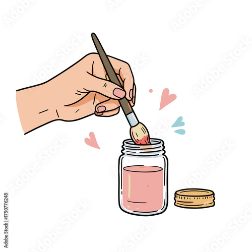 Hand holding paintbrush dipping into pink paint jar with lid  