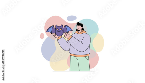 Smiling person gently holds a friendly cartoon bat Represents care nature or playful Halloween