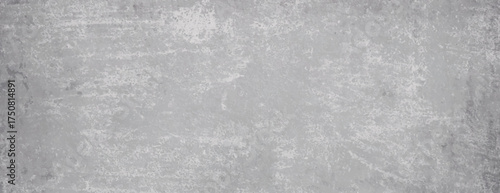 Grunge-style background with a textured, distressed look. The background is gray, featuring a rough, gray surface with a worn appearance. Rough concrete texture background. Gray background vector.