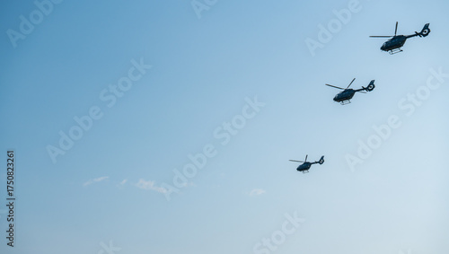 Budapest, Hungary - August 20, 2024: Three military helicopters performing at Budapest air show