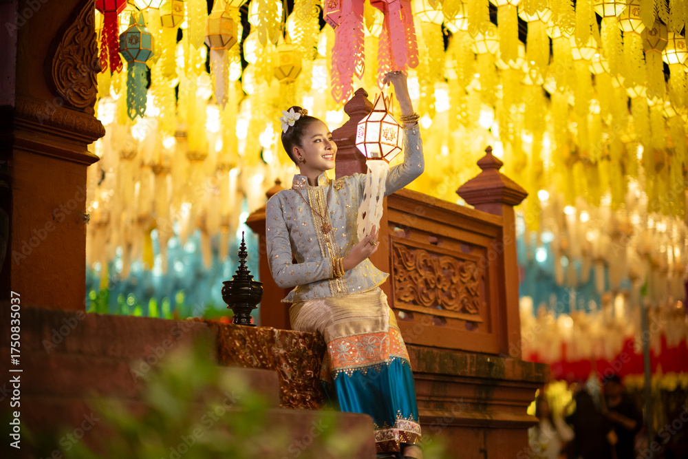 Φωτογραφία Beautiful Asian women holding a traditional paper lantern during Yi peng lantern festival at Wat Phra That Hariphunchai, Lamphun province, Thailand