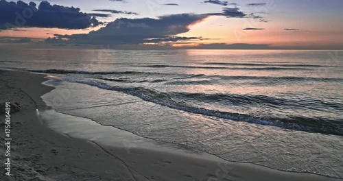 Calm golden sunset over Batlic sea in summer.