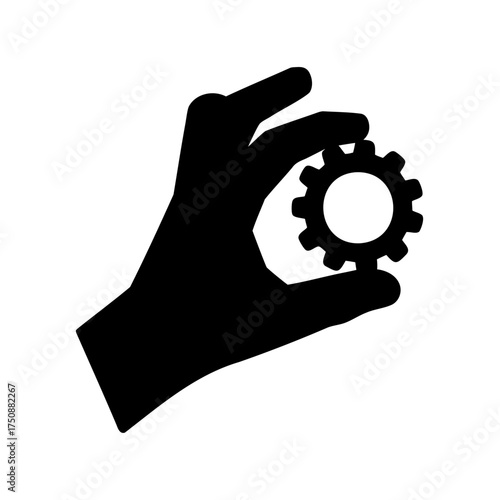 Hand delicately holding a gear, a representation of precision and engineering