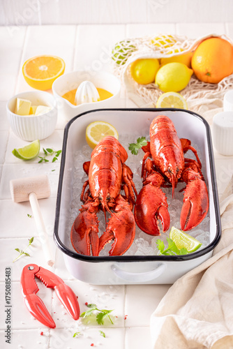 Boiled red lobster served with orange sauce.