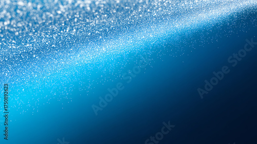 Close-up image of sparkling water droplets creating a shimmering, wave-like effect against a deep blue background