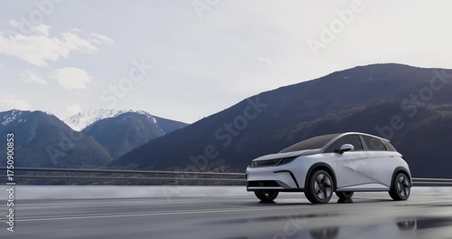Modern white electric car driving on a highway in the mountains