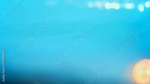 Abstract Blue Ocean Surface With Out Of Focus City Lights Bokeh Effect At Dusk