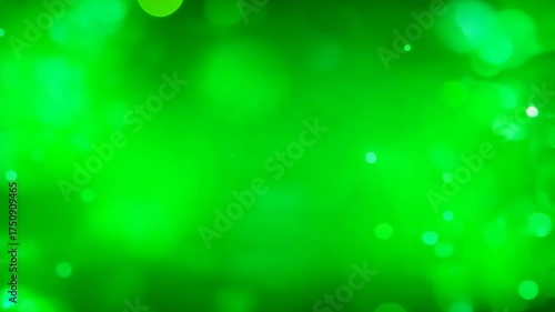 Abstract bokeh lights in vibrant green hues with soft focus background and glowing orbs creating a magical and ethereal atmosphere