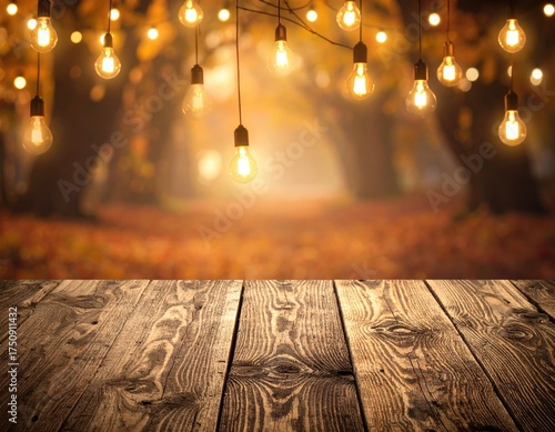 Wooden Table with Blurred Autumnal Trees and Warm String Lights Display Background in Warm Hues with Soft Focus and Texture Wood Grain