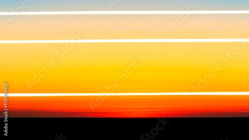 Vibrant sunset over a horizon with streaks of light, creating a serene atmosphere