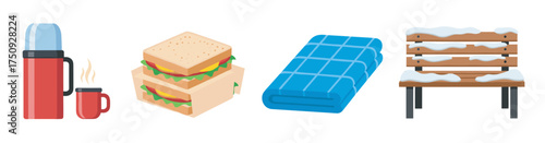 Set of winter picnic essentials including a steaming thermos with a mug, two sandwiches, a folded blue blanket, and a snow-covered wooden bench.