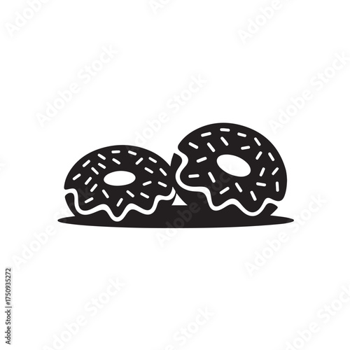 Two black donuts with white icing and sprinkles isolated on white background