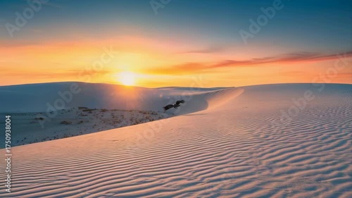 Golden Sunset Over Rippled Sand Dunes With A Bird Soaring Above At Dusk