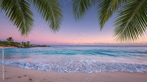 Serene tropical beach paradise at sunset with beautiful palm leaves framing calm ocean water. colorful sky reflects on sand and gentle waves for tranquil scene