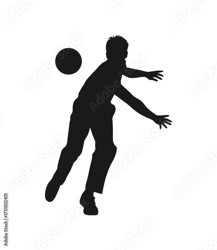 Silhouette of a male cricket bowler in action throwing a ball during a match