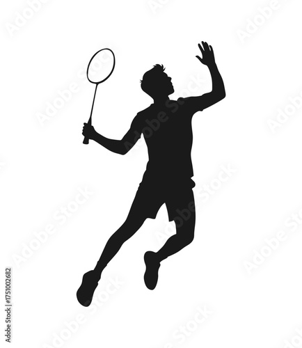 Dynamic silhouette of a badminton player in mid air hitting a shuttlecock during a match silhouette