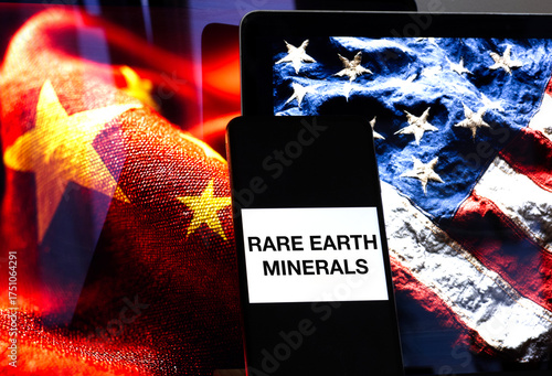 Rare Earth Minerals concept shown on a smartphone screen against a blurred background of the American and Chinese flags, representing trade tensions and embargo concerns over critical minerals.