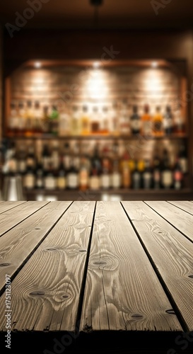 Wallpaper Mural Empty wooden bar counter with blurred background of bottles and shelves in a dimly lit establishment Torontodigital.ca