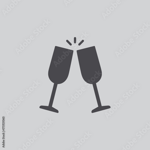 Celebrating with a toast two dark wine glasses clinking together