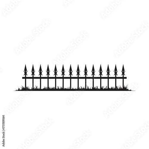 Silhouette of gothic iron fence with pointed spikes representing haunted halloween cemetery and spooky mood