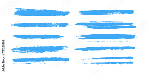 Strokes of blue paint isolated on white background. Line stroke of blue paint isolated white background. Blue abstract painted ink strokes set on watercolor paper.