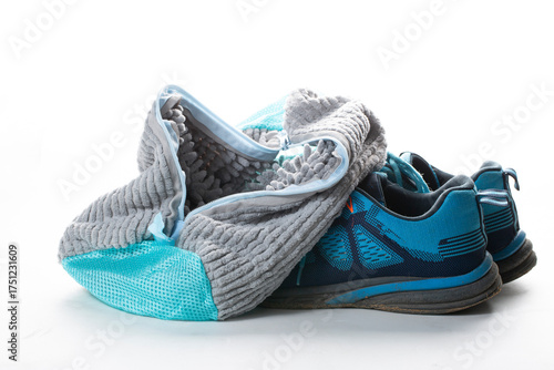 Washing shoes in a washing machine using a special washing bag.