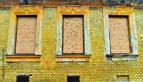 Old 19 century building with broken shutters.
