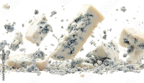 Blue cheese crumbles and chunks floating against a stark black background