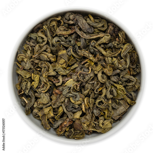 Green Ceylon single estate tea (Green OPA grade) from the Ruhuna region, Sri Lanka, loose dried leaves presented in a white bowl, viewed from above