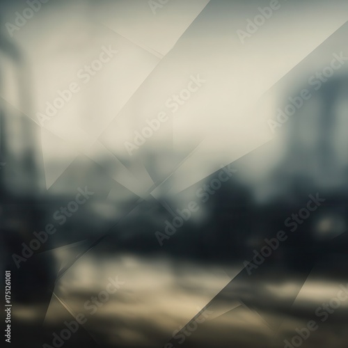Abstract geometric shapes create a muted, blurred background.