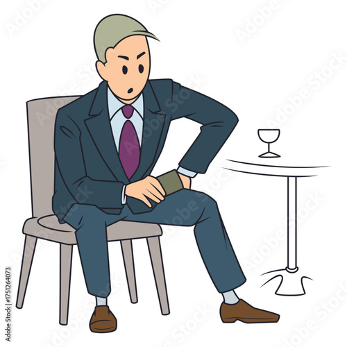 Man is sitting at table in cafe.
