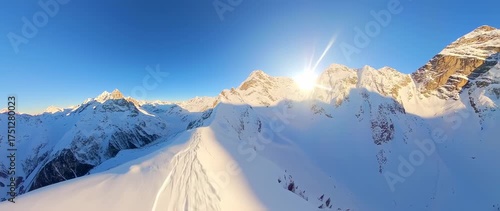 Wallpaper Mural Stunning aerial panorama of snow-covered peaks bathed in golden sunlight a majestic alpine landscape Torontodigital.ca