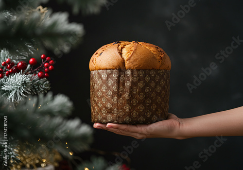Warm holiday feelings holding a delicious panettone near a decorated tree, inviting Christmas cheer and sweet family moments for cozy celebrations