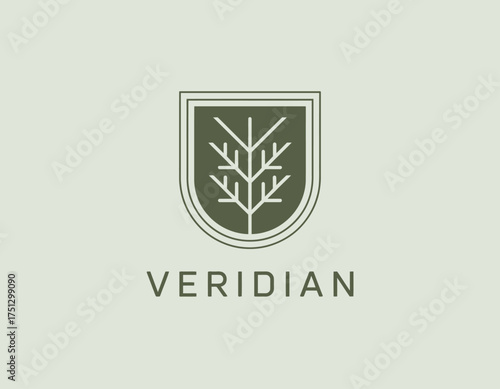 This logo design showcases a tree within a shield, representing environmental conservation and protection. Ideal for organizations dedicated to sustainability and nature.