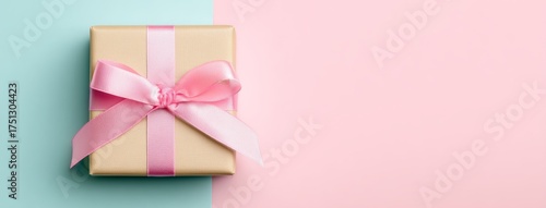 Gift Box Wrapped in Blue and Pink Ribbon on Pastel Background
