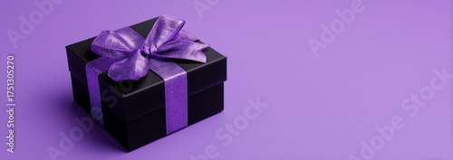 Gift Box With Purple Ribbon Set Against a Vibrant Purple Background in a Simp...
