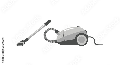 Modern gray canister vacuum cleaner with hose and floor nozzle.