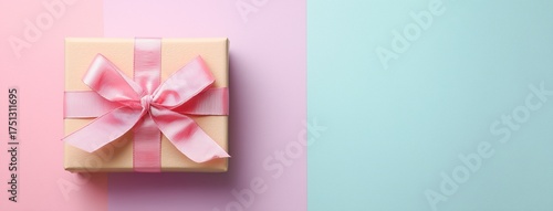 Gift Box Wrapped With Pink Ribbon on a Blue Background With Soft Pink Color